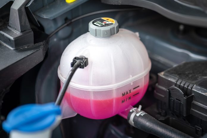A,Car's,Engine,Coolant,Water,Supply,Box,Filled,With,Pink